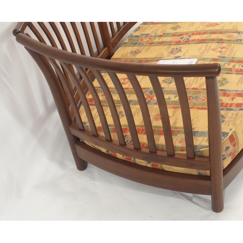 124 - AN ERCOL RENAISSANCE THREE PIECE SUITE