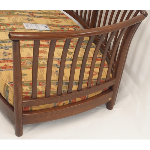 124 - AN ERCOL RENAISSANCE THREE PIECE SUITE