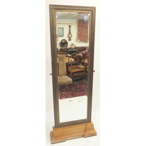 125 - A LARGE BRASS FRAMED CHEVAL TWO SIDED MIRROR