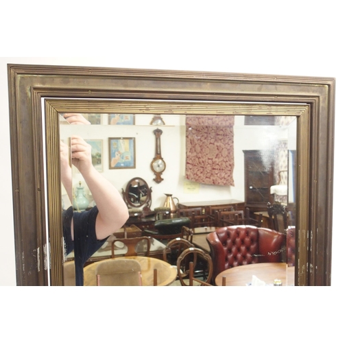 125 - A LARGE BRASS FRAMED CHEVAL TWO SIDED MIRROR