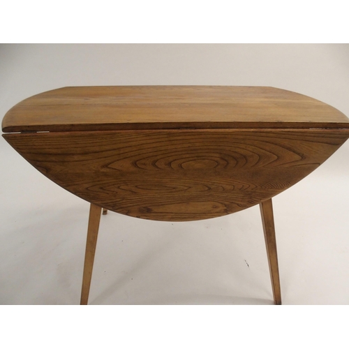 127 - AN ERCOL DROP LEAF TABLE WITH TAPERED LEGS