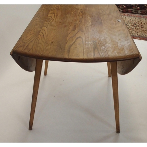 127 - AN ERCOL DROP LEAF TABLE WITH TAPERED LEGS