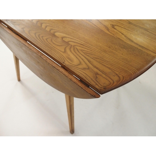 127 - AN ERCOL DROP LEAF TABLE WITH TAPERED LEGS