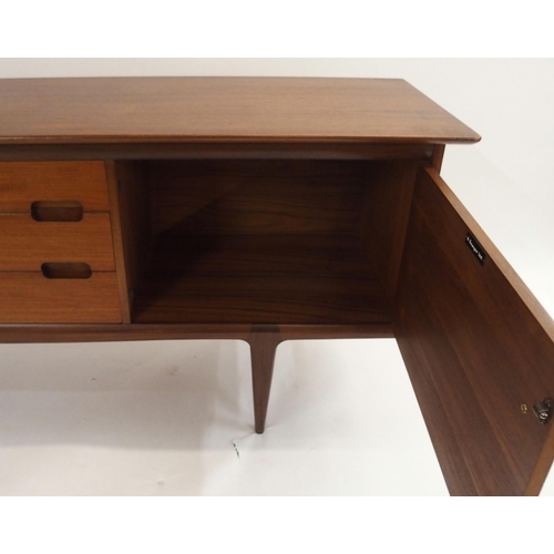 129 - A YOUNGER TEAK SIDEBOARD ON TAPERED LEGS