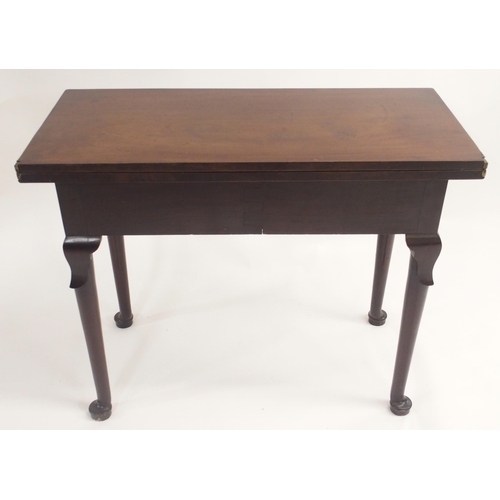 2 - A GEORGE III MAHOGANY FOLD OVER TEA TABLE