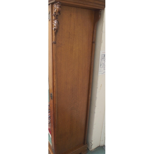 23A - AN EARLY 20TH CENTURY OAK ARTS AND CRAFTS TRIPLE DOOR WARDROBE