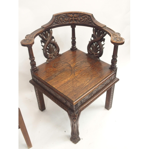 63 - A VICTORIAN OAK CORNER ARMCHAIR