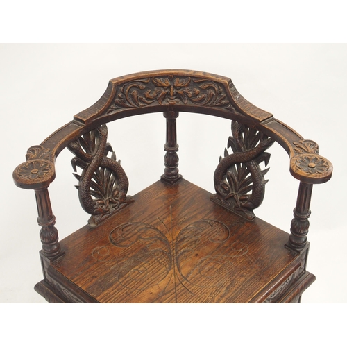 63 - A VICTORIAN OAK CORNER ARMCHAIR