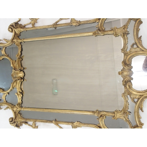 67 - A CHIPPENDALE STYLE GILTWOOD MIRROR