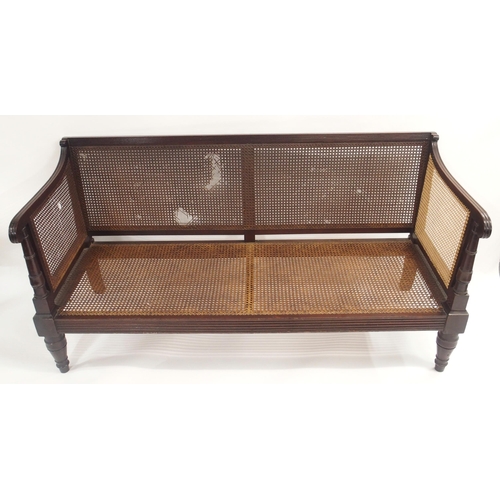 88A - A VICTORIAN EBONISED BERGERE SETTEE