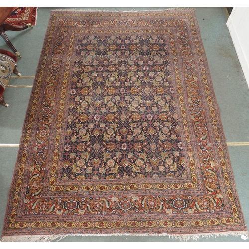 89 - A BLUE GROUND EASTERN RUG WITH ALLOVER FLORAL DESIGN