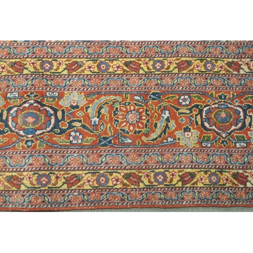 89 - A BLUE GROUND EASTERN RUG WITH ALLOVER FLORAL DESIGN