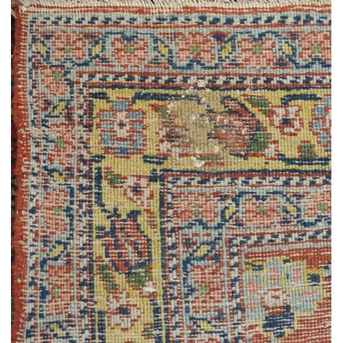 89 - A BLUE GROUND EASTERN RUG WITH ALLOVER FLORAL DESIGN