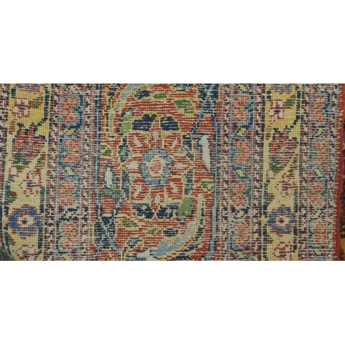 89 - A BLUE GROUND EASTERN RUG WITH ALLOVER FLORAL DESIGN