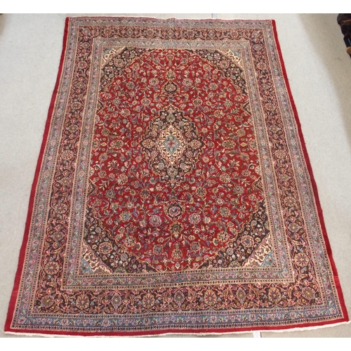 93 - A RED GROUND KESHAN RUG