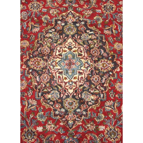 93 - A RED GROUND KESHAN RUG