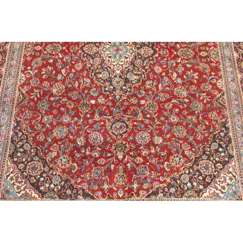 93 - A RED GROUND KESHAN RUG