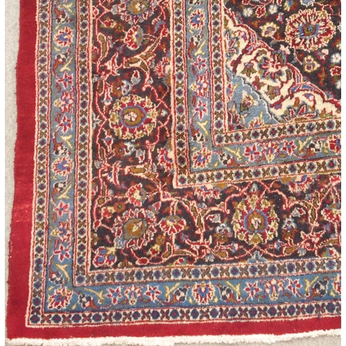 93 - A RED GROUND KESHAN RUG