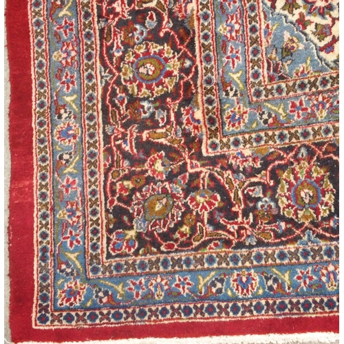 93 - A RED GROUND KESHAN RUG