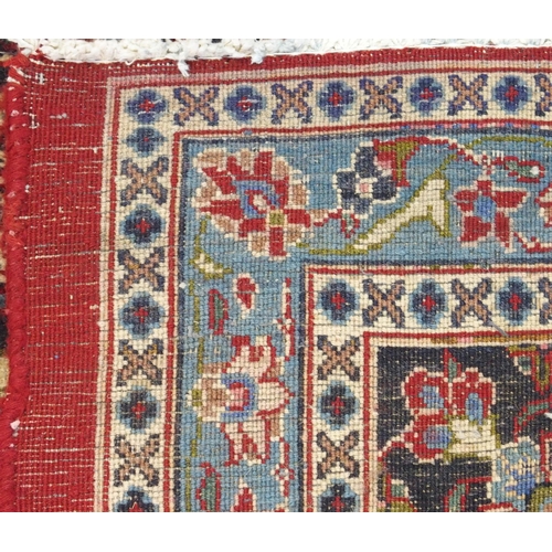 93 - A RED GROUND KESHAN RUG