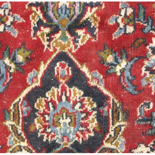 93 - A RED GROUND KESHAN RUG