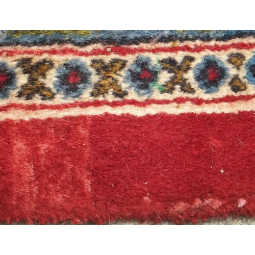 93 - A RED GROUND KESHAN RUG