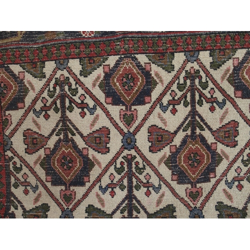 97 - A CREAM GROUND RUNNER WITH STYLISED FLOWERS