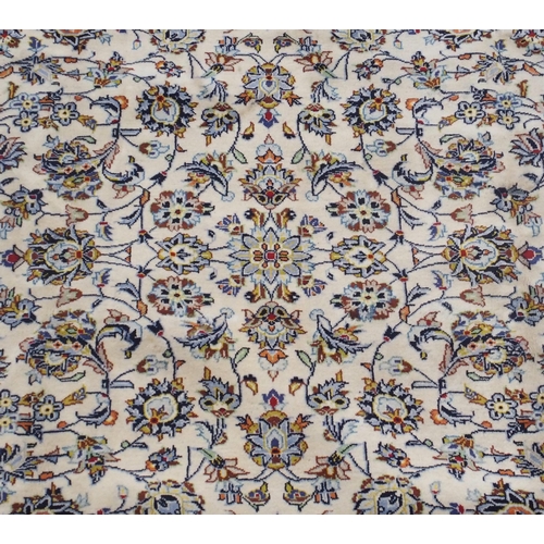 98 - A CREAM GROUND KESHAN RUG