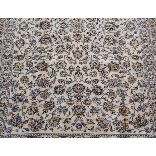 98 - A CREAM GROUND KESHAN RUG