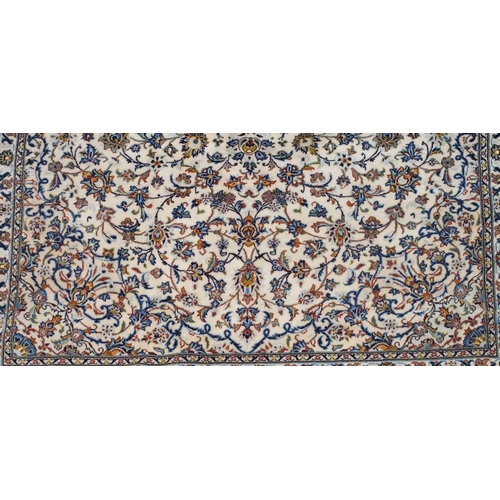 99 - A CREAM GROUND FINE KESHAN LAMBS WOOL RUG