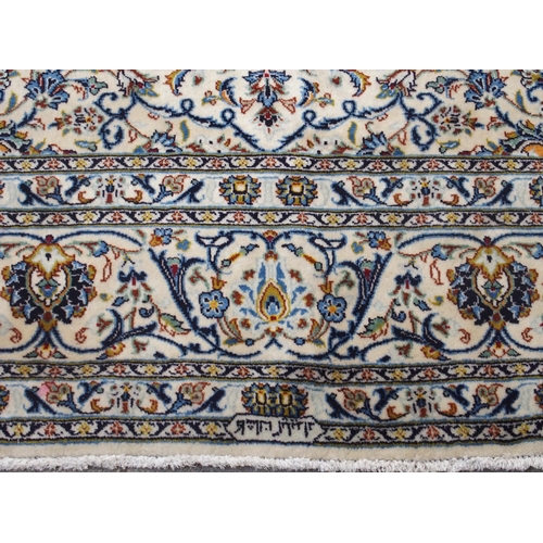 99 - A CREAM GROUND FINE KESHAN LAMBS WOOL RUG