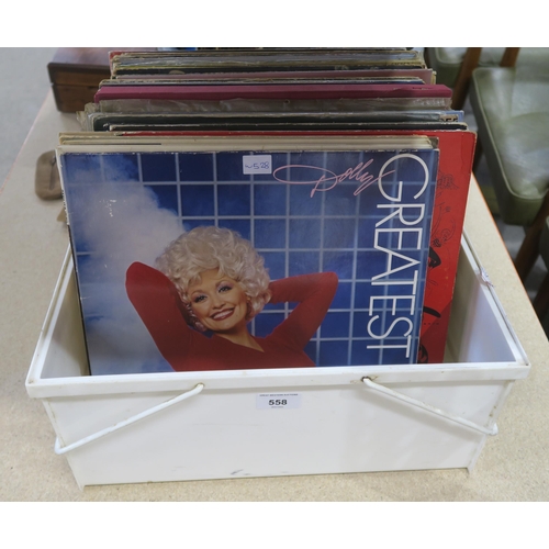 558 - A box of vinyl LP records with the Rocky III soundtrack, Dolly Parton, The Theme from Dallas, Genesi... 