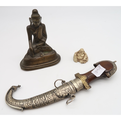 564 - A bronze Buddha together with a smaller example and an eastern decorative dagger