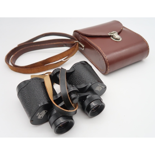 565 - A pair of Carl Zeis Jena Jenoptem 8x30 binoculars serial number 6537625 together with a pair of Star... 