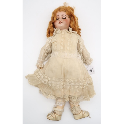 572 - A golden haired child's doll