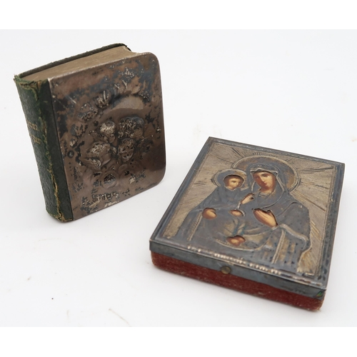 573 - A continental silver icon together with a silver bound common prayer book