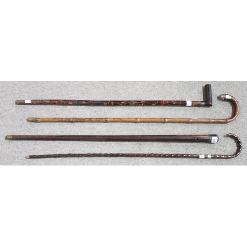 603 - FOUR VARIOUS WALKING STICKS each with white metal mounts (4)