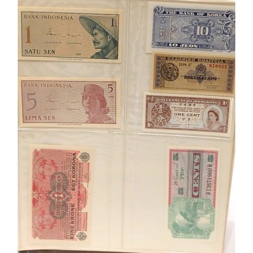 541 - A collection of bank notes with colonial examples, German, Dutch, Indonesian, Caribbean etc