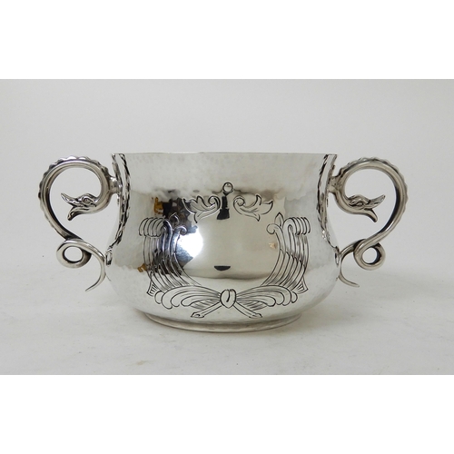 103 - AN EDWARDIAN HAMMERED SILVER PORRINGER