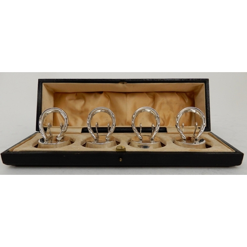 118 - A CASED SET OF FOUR SILVER PLACECARD OR MENU HOLDERS