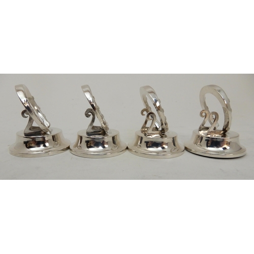 118 - A CASED SET OF FOUR SILVER PLACECARD OR MENU HOLDERS