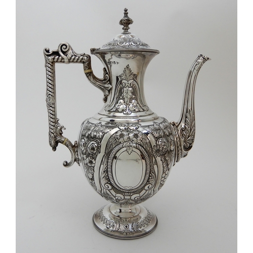 124 - A LATE VICTORIAN SILVER COFFEE POT