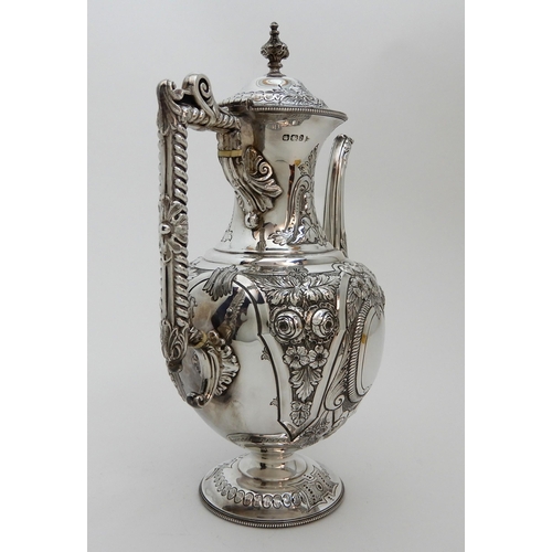 124 - A LATE VICTORIAN SILVER COFFEE POT