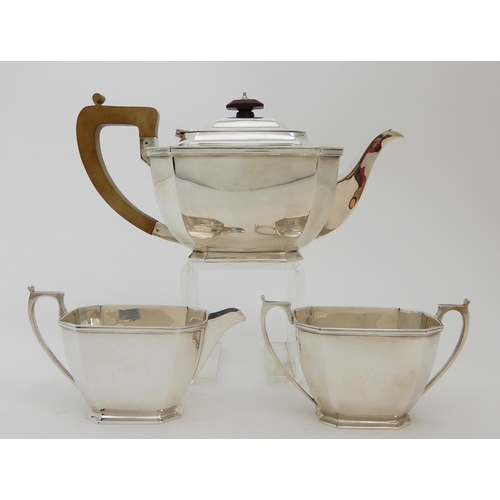 125 - A THREE PIECE SILVER TEA SERVICE