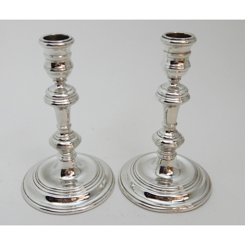 126 - A PAIR OF GEORGIAN STYLE SILVER CANDLESTICKS