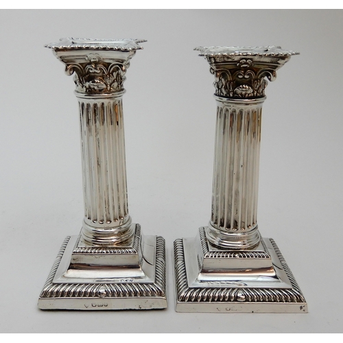 127 - A PAIR OF SILVER CANDLESTICKS