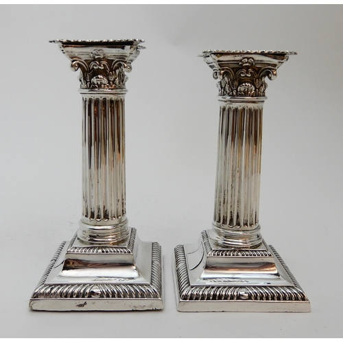 127 - A PAIR OF SILVER CANDLESTICKS