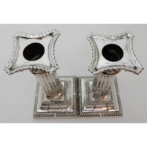 127 - A PAIR OF SILVER CANDLESTICKS