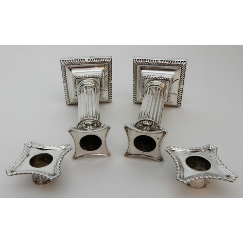 127 - A PAIR OF SILVER CANDLESTICKS