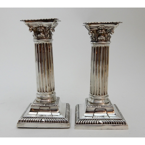 127 - A PAIR OF SILVER CANDLESTICKS